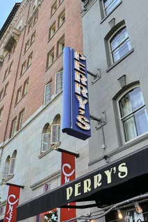 a front view of a building with a sign board