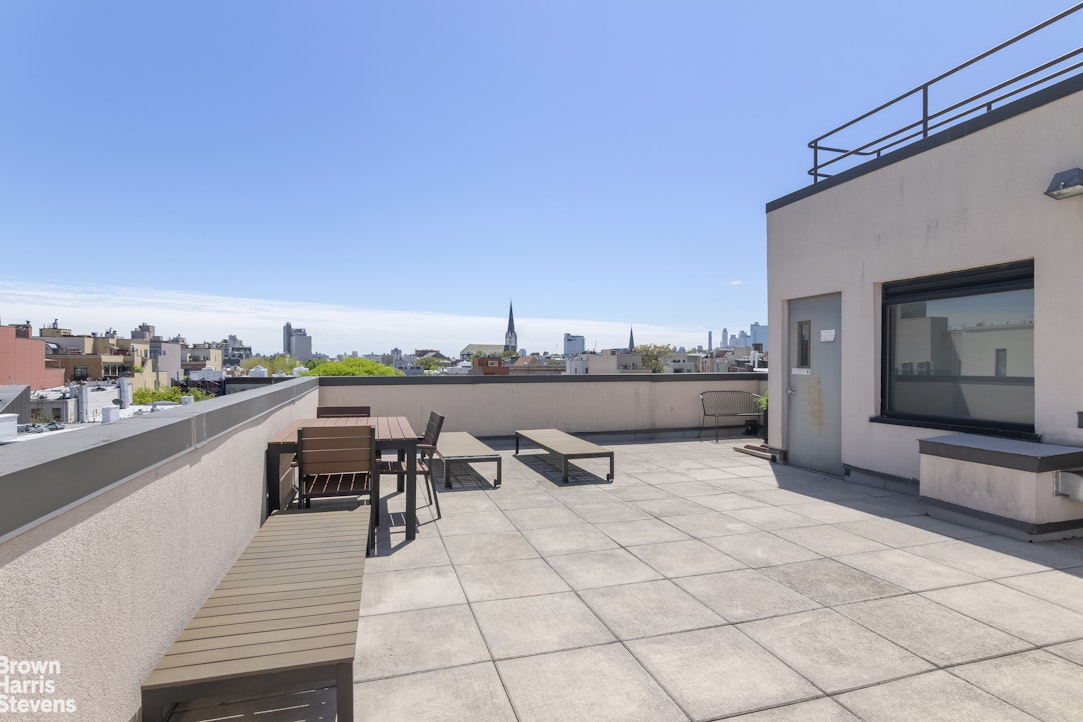 199 Huron Street, Unit 4D Brooklyn, NY 11222 - Photo 7 of 8 a terrace with outdoor seating and city view
