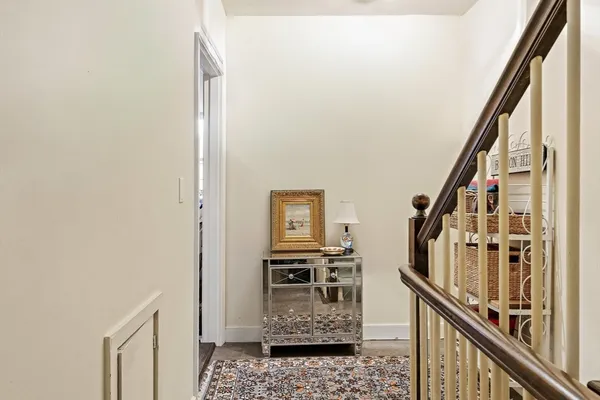 a view of an entryway with wooden floor