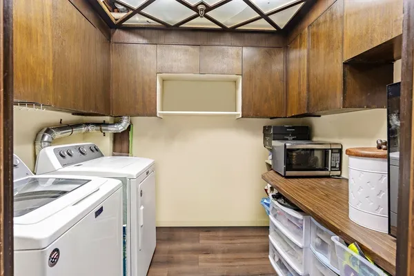 a view of a kitchen with washer and dryer