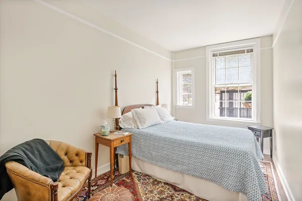a bedroom with a bed and window
