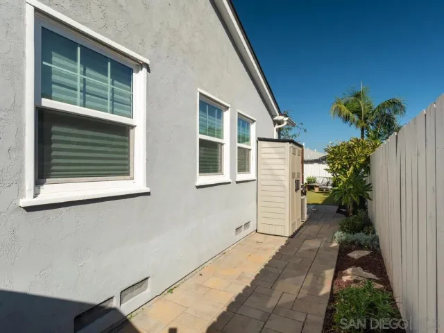 a house with potted plants in front of door