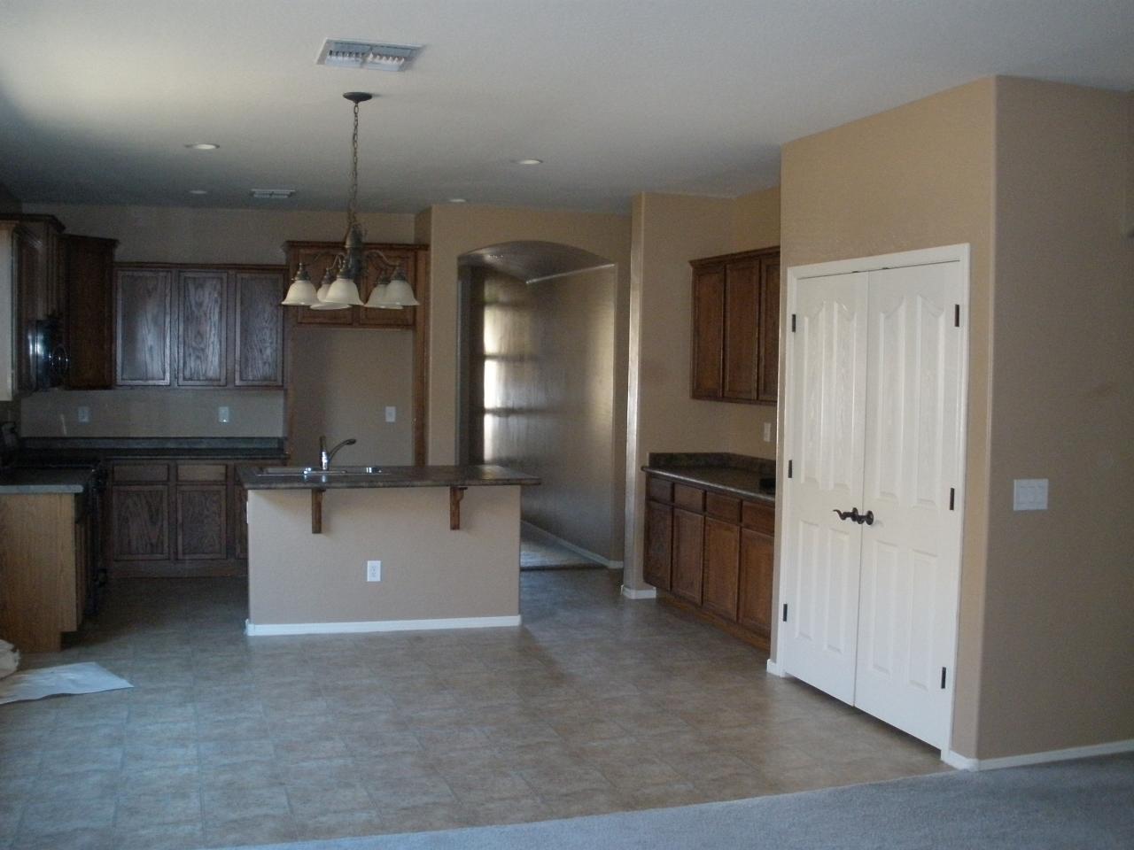 18011 West Hatcher Road Waddell, AZ 85355 - Photo 3 of 12 Breakfast area looking into kitchen