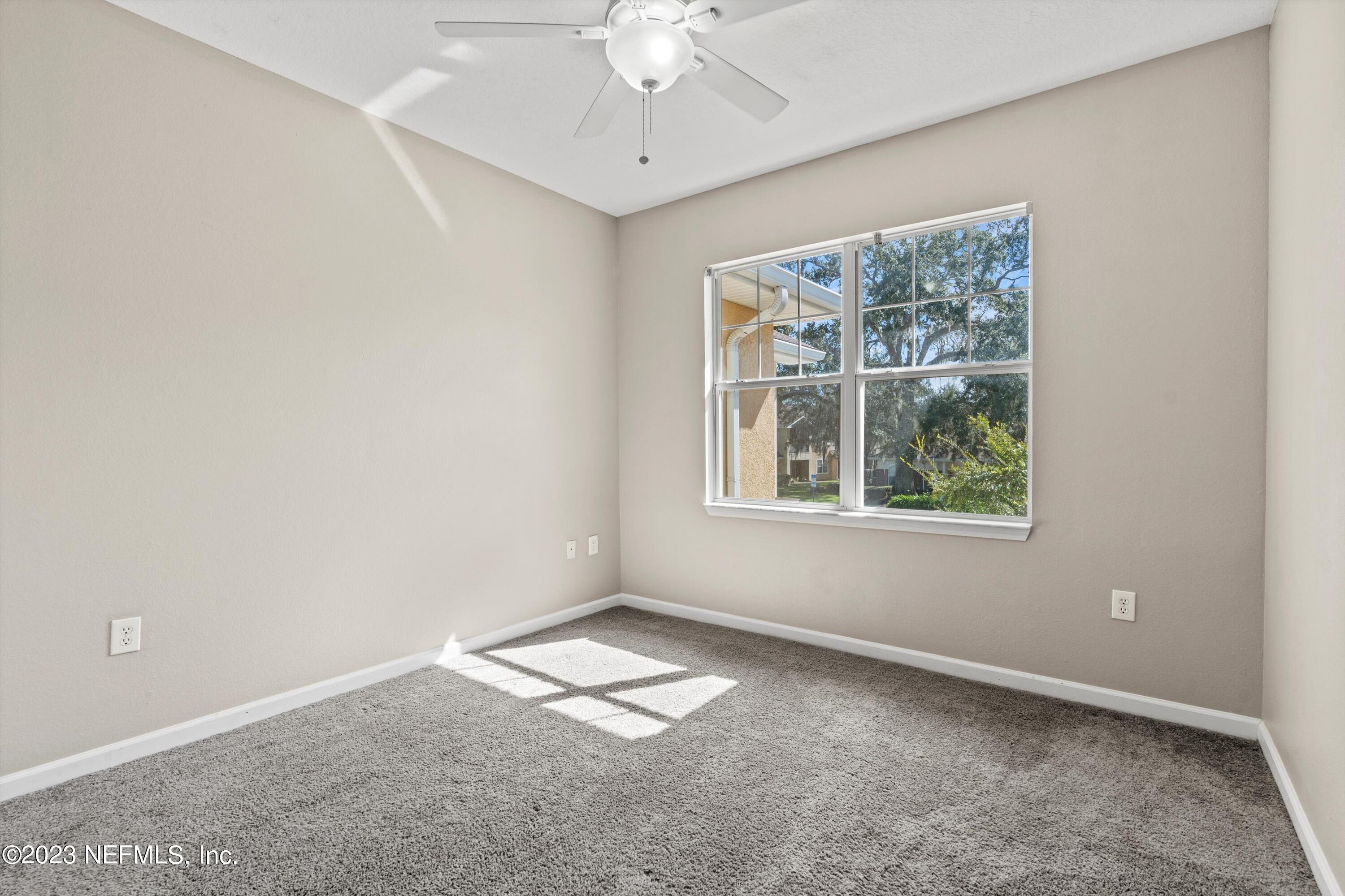 5663 Greenland Road, Unit 1005 Jacksonville, FL 32258 - Photo 18 of 30 an empty room with a window