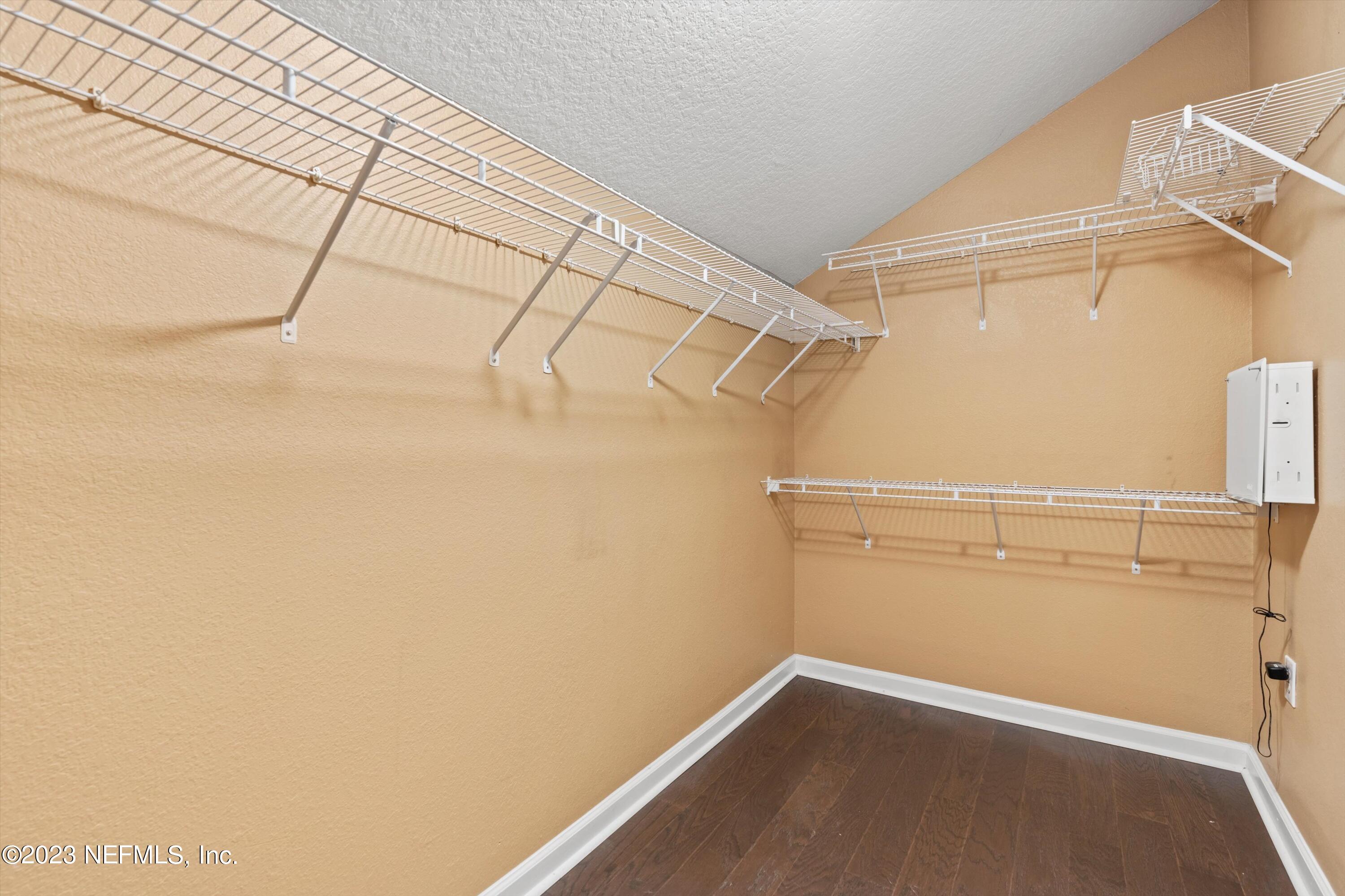 5663 Greenland Road, Unit 1005 Jacksonville, FL 32258 - Photo 24 of 30 a view of a room with racks on the wall