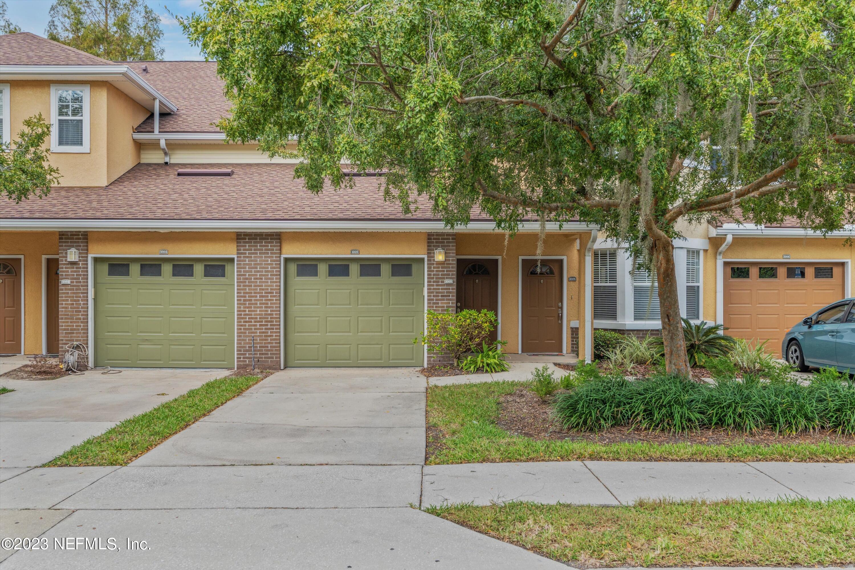 5663 Greenland Road, Unit 1005 Jacksonville, FL 32258 - Photo 3 of 30 front view of a house with a small yard