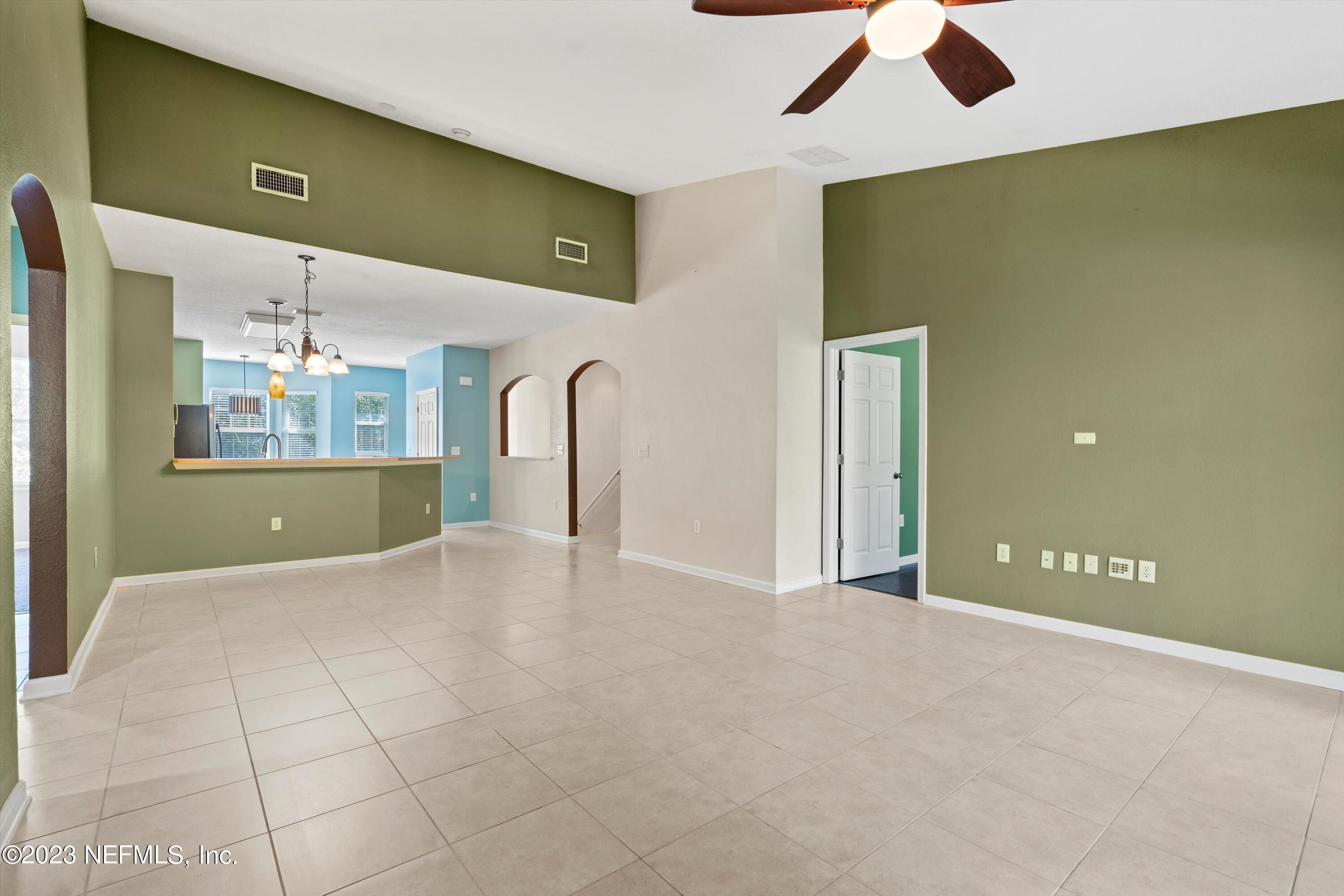5663 Greenland Road, Unit 1005 Jacksonville, FL 32258 - Photo 10 of 30 a view of a livingroom with a kitchen