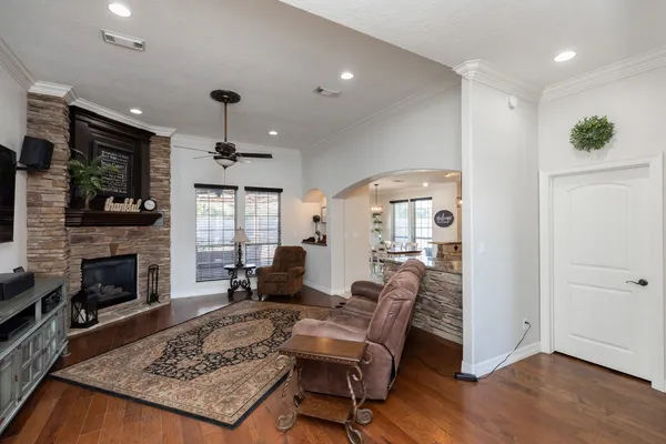 a living room with furniture and a fireplace