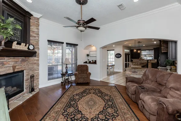 a living room with furniture and a fireplace