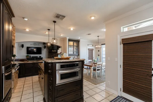a kitchen with a stove and a refrigerator