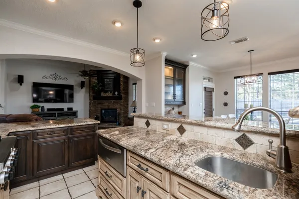 a kitchen with a sink stove and microwave