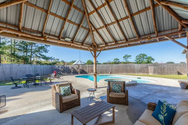 a view of a swimming pool with a patio