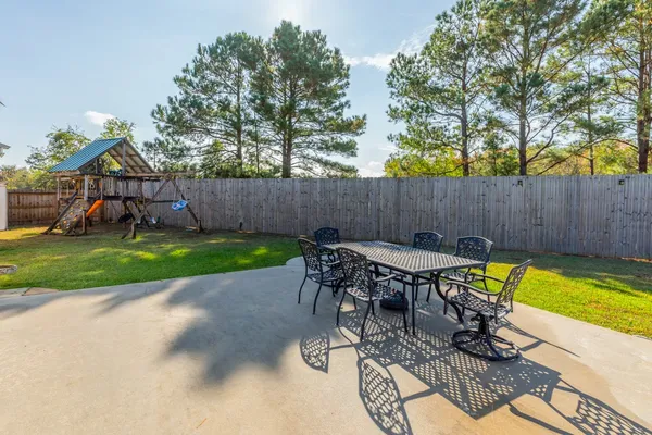 a view of yard with seating area and furniture