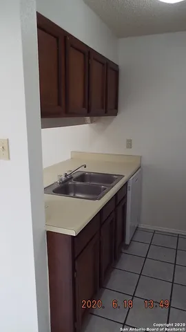 a kitchen with a sink and cabinets