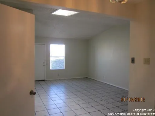 a view of an empty room and window