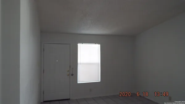 a view of an empty room and window