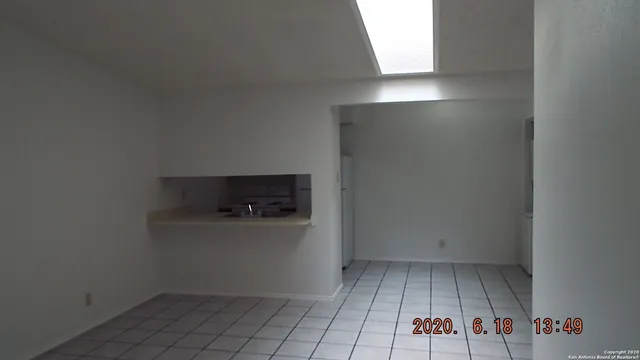 a view of a kitchen with storage and utility