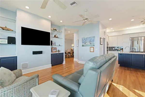 a kitchen with stainless steel appliances granite countertop wooden cabinets and sink