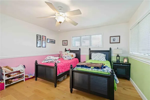 a living room with lots of furniture and a book shelf