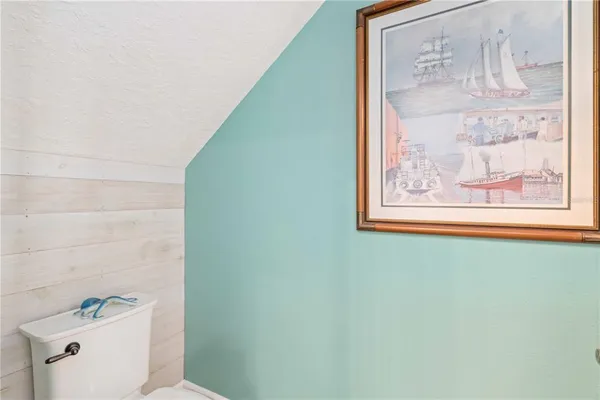 a view of a big house with swimming pool and chairs