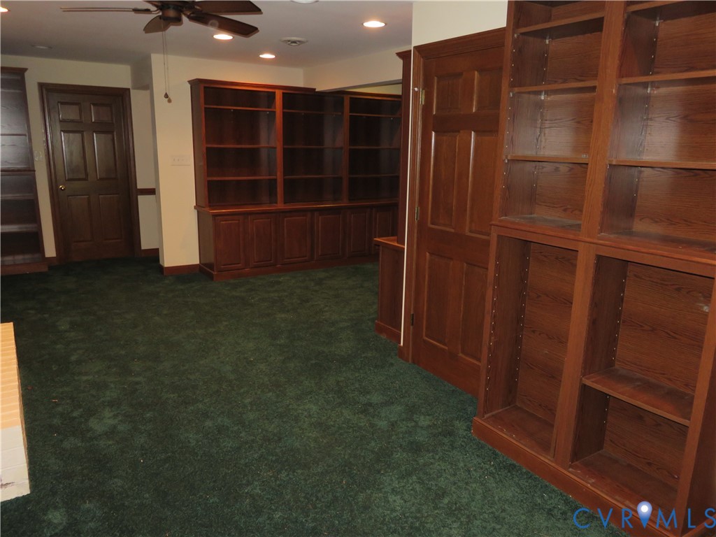 8379 Quailfield Road Mechanicsville, VA 23116 - Photo 49 of 56 a view of an empty room with wooden floor and cabinet
