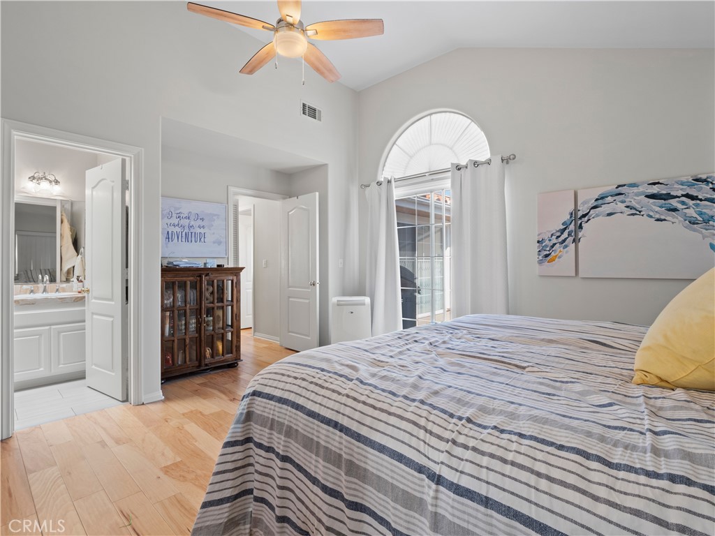 2517 Rockefeller Lane, Unit B Redondo Beach, CA 90278 - Photo 12 of 36 a bedroom with a bed and a chandelier