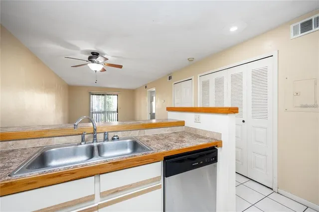 a view of a sink a faucet a chandelier