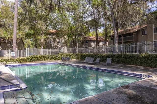 a view of swimming pool with a patio