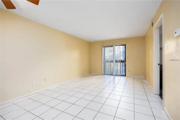 a view of an empty room and window