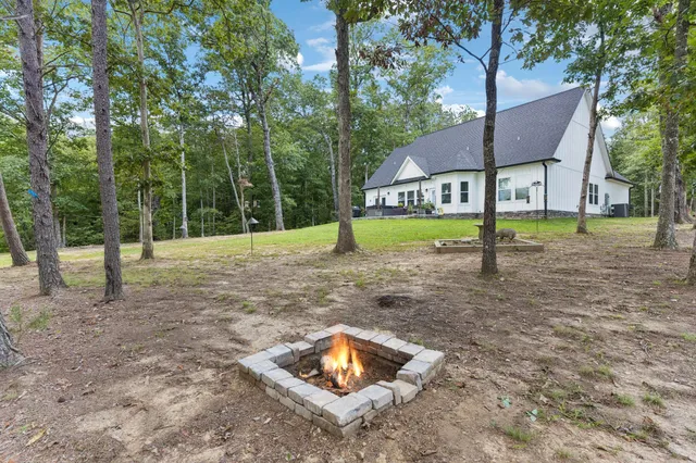 a house that has a tree in front of it