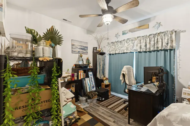 a living room with lots of furniture and a chandelier