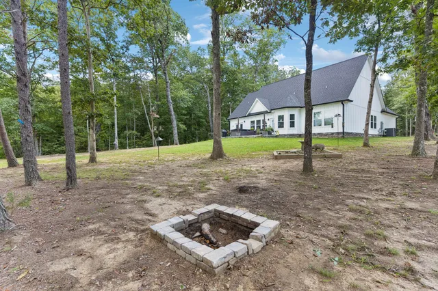 a tall building with trees in front of it