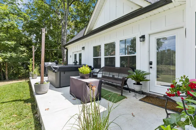 a big house with a big yard and large trees