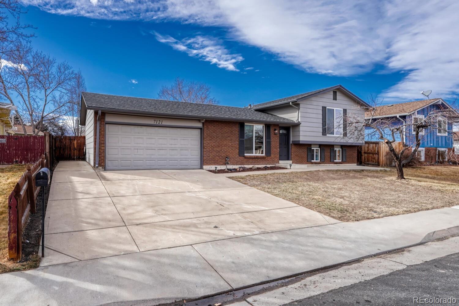7121 Xavier Street Westminster, CO 80030 - Photo 1 of 23 a house view with a outdoor space