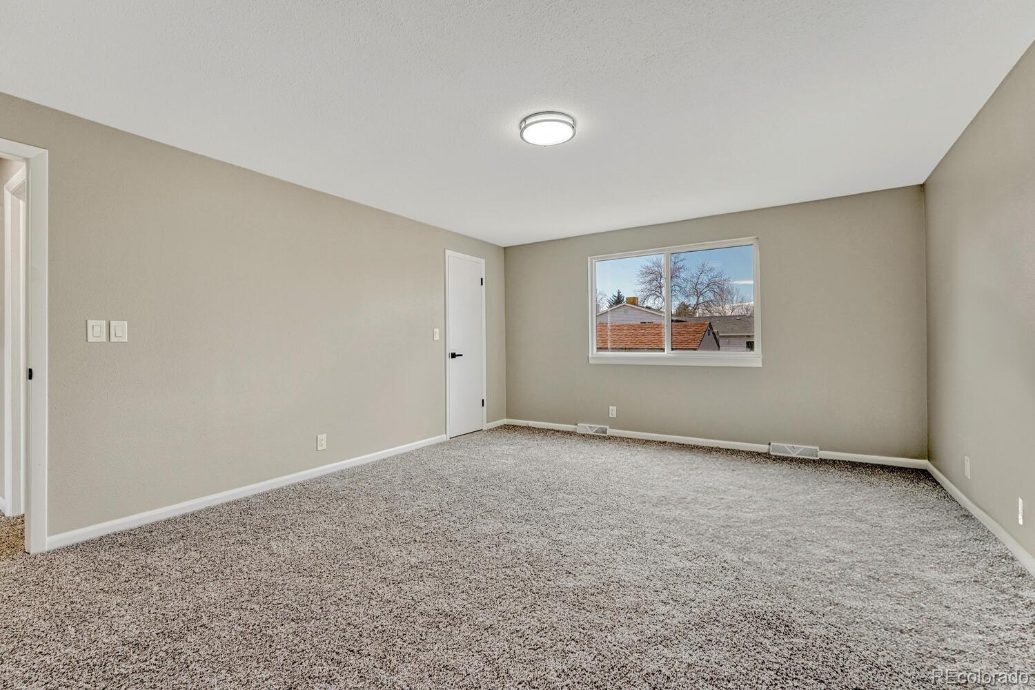 7121 Xavier Street Westminster, CO 80030 - Photo 11 of 23 a view of an empty room with a window