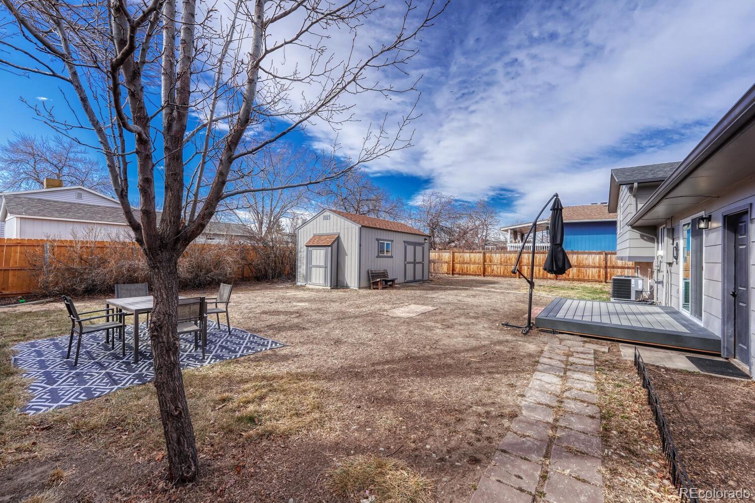 7121 Xavier Street Westminster, CO 80030 - Photo 23 of 23 a front view of a house with a yard