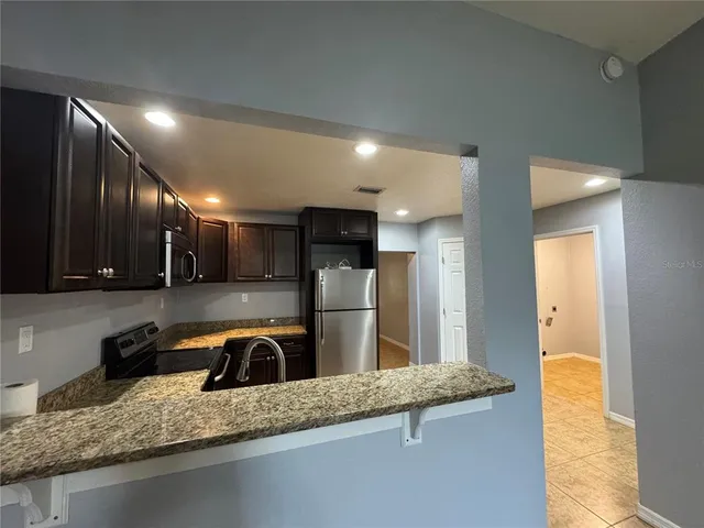 a view of an empty room with a fan