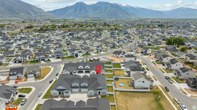 531 North Legend Way West, Unit D Mapleton, UT 84664 - Photo 35 of 42 Aerial view of residential area with a mountain backdrop