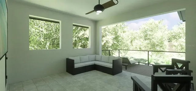 a living room with furniture and a large window