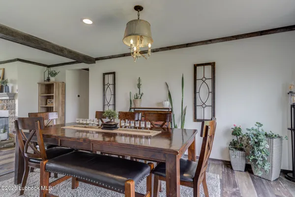 a view of kitchen and dining room with wooden floor