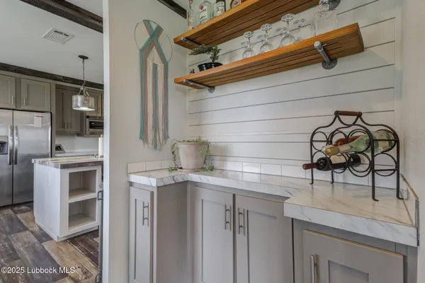 a kitchen with stainless steel appliances granite countertop a stove and a sink
