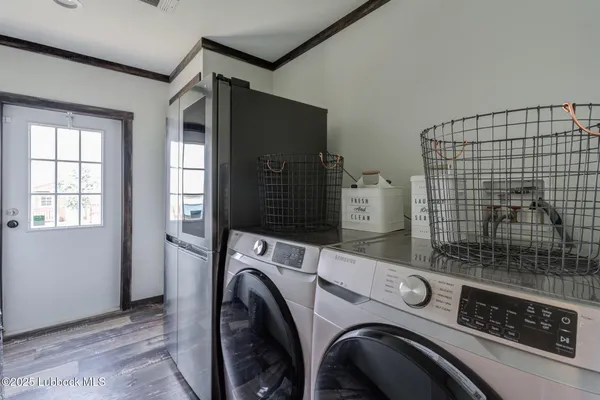 a bedroom with furniture and wooden floor