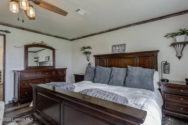 a kitchen with kitchen island granite countertop a sink cabinets stainless steel appliances and a large window