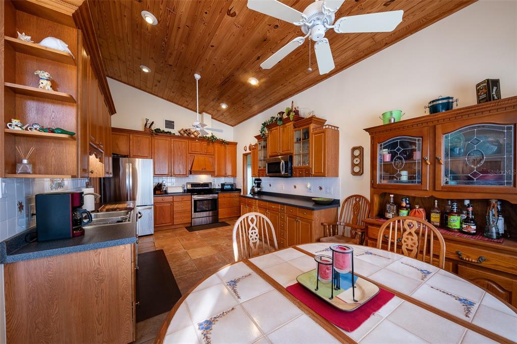 1862 Wind Willow Road Belle Isle, FL 32809 - Photo 11 of 42 a living room with lots of furniture and kitchen view