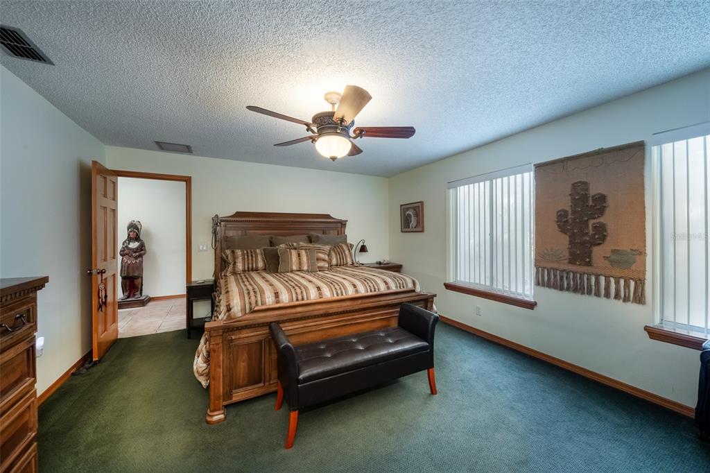 1862 Wind Willow Road Belle Isle, FL 32809 - Photo 13 of 42 a bedroom with a bed and a window