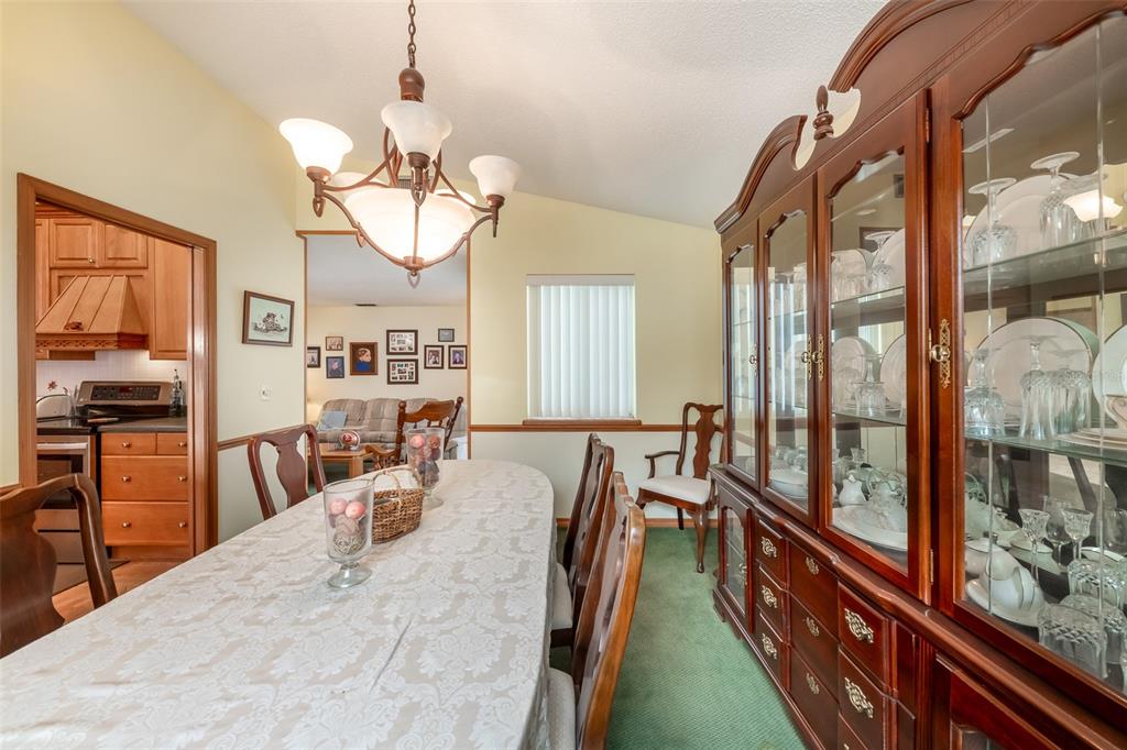 1862 Wind Willow Road Belle Isle, FL 32809 - Photo 15 of 42 a view of a dining room with furniture window and outside view