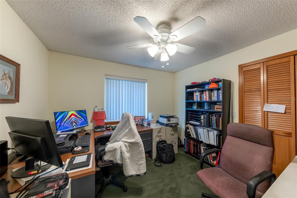 1862 Wind Willow Road Belle Isle, FL 32809 - Photo 19 of 42 a view of a livingroom with furniture and a bookshelf