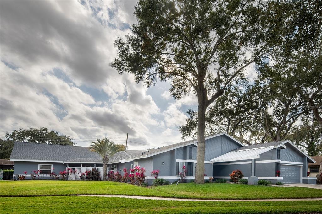 1862 Wind Willow Road Belle Isle, FL 32809 - Photo 2 of 42 a front view of house with yard and green space