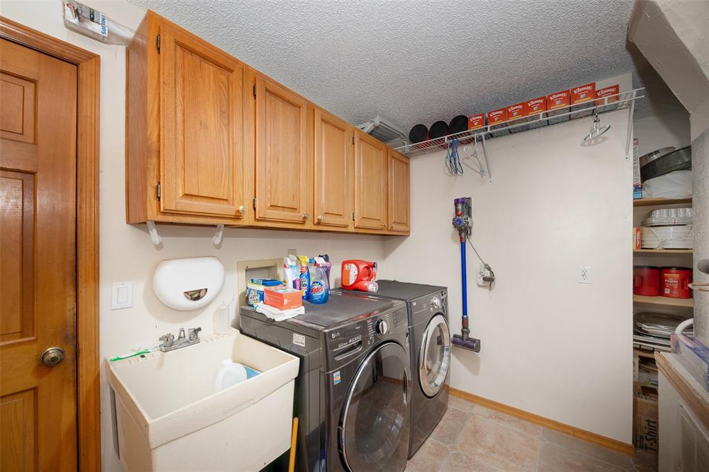 1862 Wind Willow Road Belle Isle, FL 32809 - Photo 22 of 42 a utility room with dryer and washer