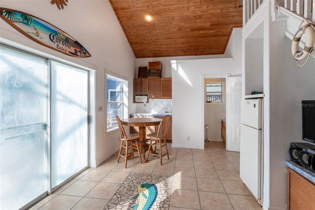 1862 Wind Willow Road Belle Isle, FL 32809 - Photo 23 of 42 a dining room with furniture and a kitchen view